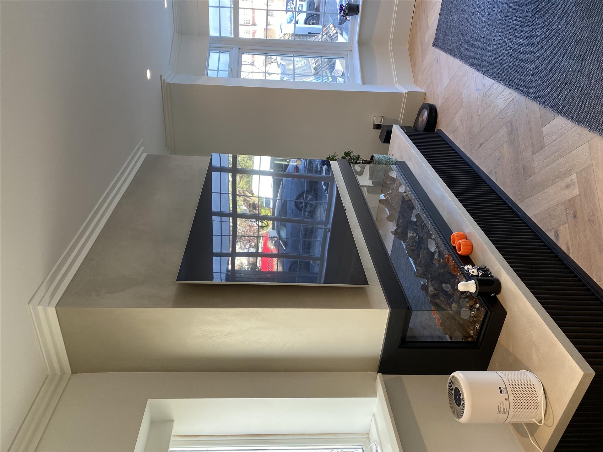 Kitchen island with microcement finish and fish tank feature, Essex